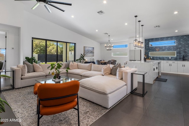 2225 E Whitton Ave E, Phoenix, AZ 85016 - living area featuring high vaulted ceiling, recessed lighting, visible vents, and ceiling fan with notable chandelier