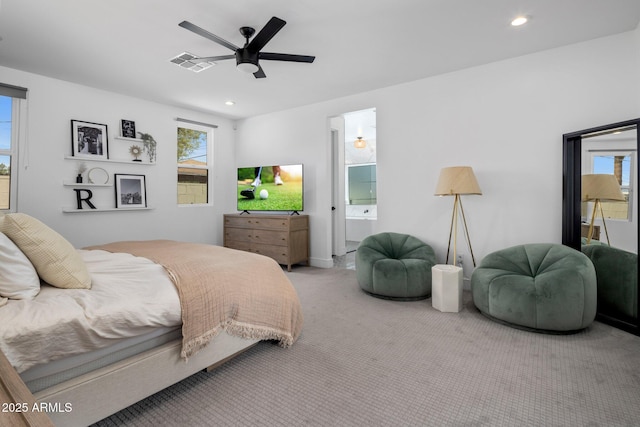 2225 E Whitton Ave E, Phoenix, AZ 85016 - carpeted bedroom with connected bathroom, multiple windows, visible vents, and recessed lighting