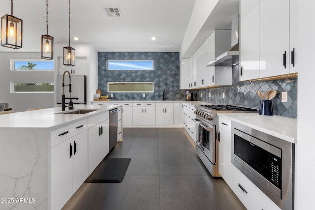 2225 E Whitton Ave E, Phoenix, AZ 85016 - kitchen with white cabinets, visible vents, decorative backsplash, stainless steel appliances, and a sink