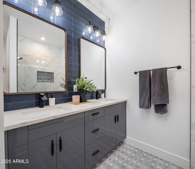 2225 E Whitton Ave E, Phoenix, AZ 85016 - full bathroom featuring a sink, backsplash, baseboards, and a marble finish shower