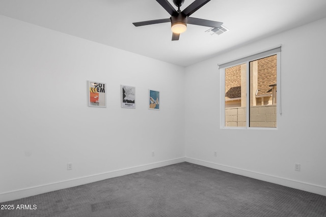 2225 E Whitton Ave E, Phoenix, AZ 85016 - empty room featuring dark carpet, ceiling fan, baseboards, and visible vents