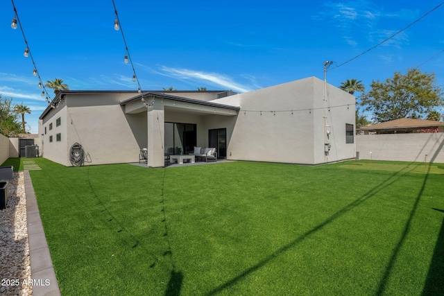 2225 E Whitton Ave E, Phoenix, AZ 85016 - back of house featuring a fenced backyard, stucco siding, a patio area, and a lawn