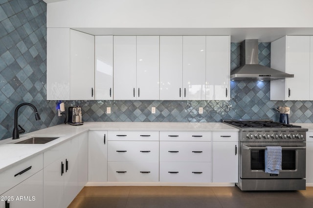 2225 E Whitton Ave E, Phoenix, AZ 85016 - kitchen with wall chimney range hood, high end range, modern cabinets, and a sink