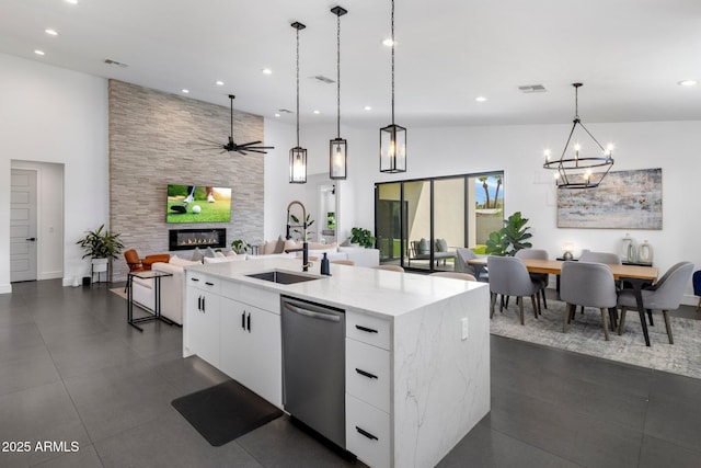 2225 E Whitton Ave E, Phoenix, AZ 85016 - kitchen featuring open floor plan, visible vents, a tile fireplace, dishwasher, and a sink