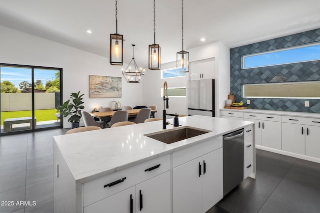 2225 E Whitton Ave E, Phoenix, AZ 85016 - kitchen with tasteful backsplash, a sink, an island with sink, stainless steel dishwasher, and light stone counters