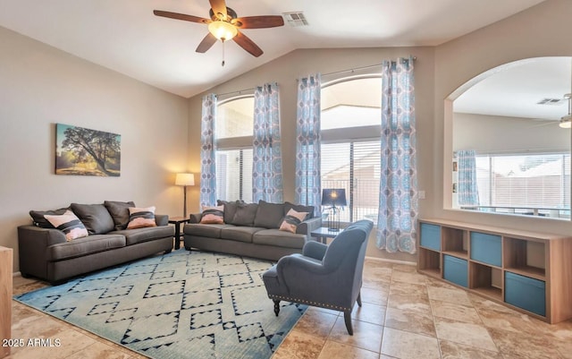 living area featuring lofted ceiling, visible vents, arched walkways, and ceiling fan