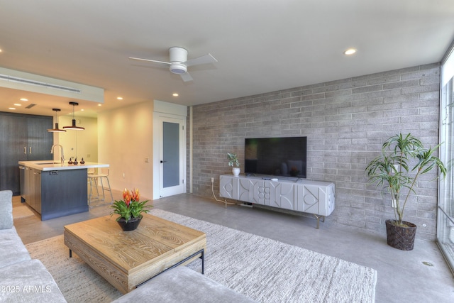 4411 N 40th St N Unit 37, Phoenix, AZ 85018 - living room with finished concrete flooring, ceiling fan, and recessed lighting