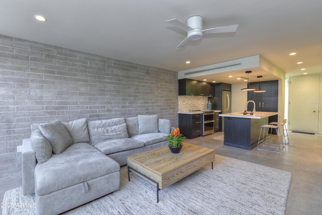 4411 N 40th St N Unit 37, Phoenix, AZ 85018 - living area featuring a ceiling fan, finished concrete floors, and recessed lighting