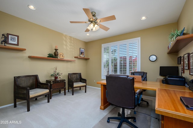 office featuring light carpet and ceiling fan