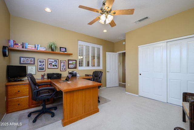 home office with light carpet and ceiling fan