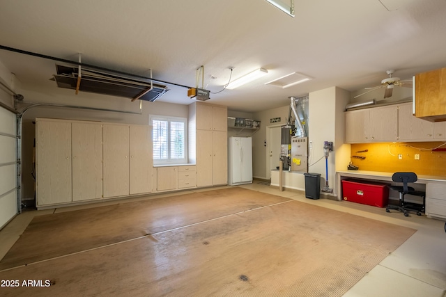 garage featuring a garage door opener and gas water heater