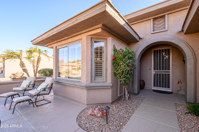 property entrance with a patio area