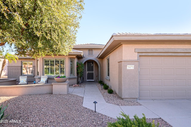 view of front of property featuring a garage