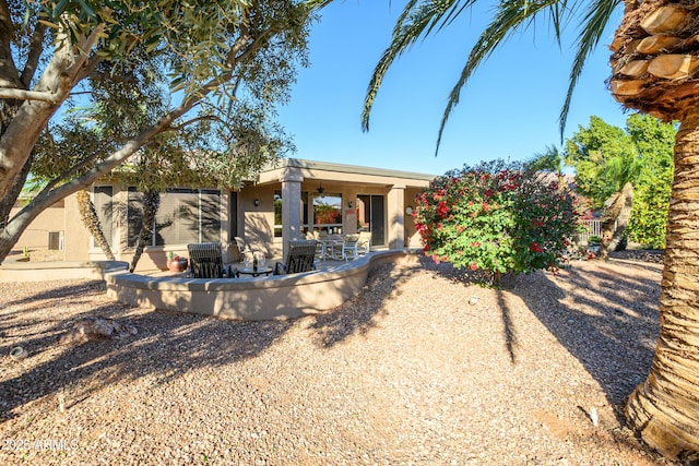 rear view of house featuring a patio