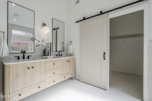 full bath featuring visible vents, a sink, and tile patterned floors