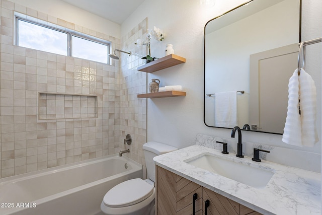 bathroom with vanity, shower / tub combination, and toilet