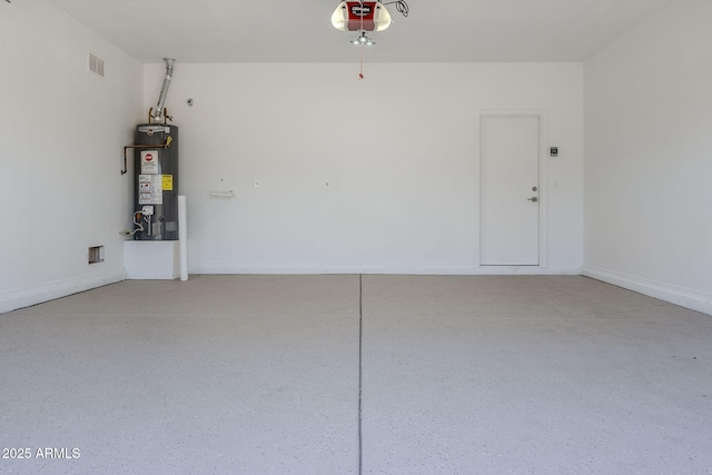 garage with baseboards, gas water heater, visible vents, and a garage door opener