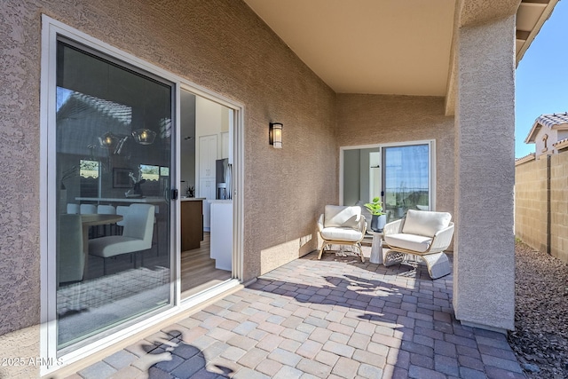 view of patio featuring fence