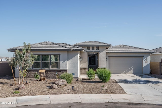 prairie-style house featuring a garage