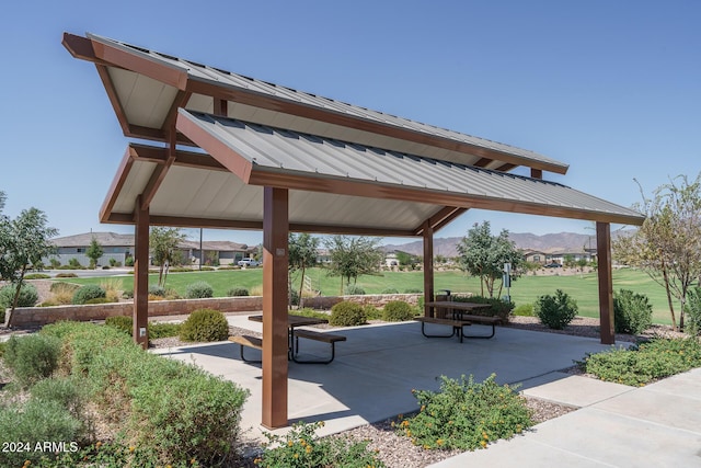 view of community featuring a gazebo, a patio area, and a yard