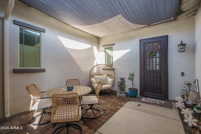 doorway to property with a patio area