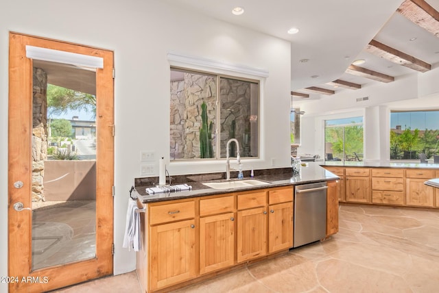 kitchen featuring beamed ceiling, dishwasher, and sink