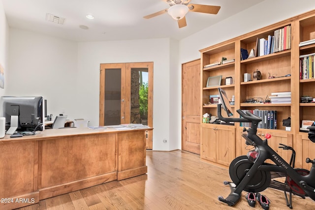 office space featuring french doors, light hardwood / wood-style flooring, and ceiling fan