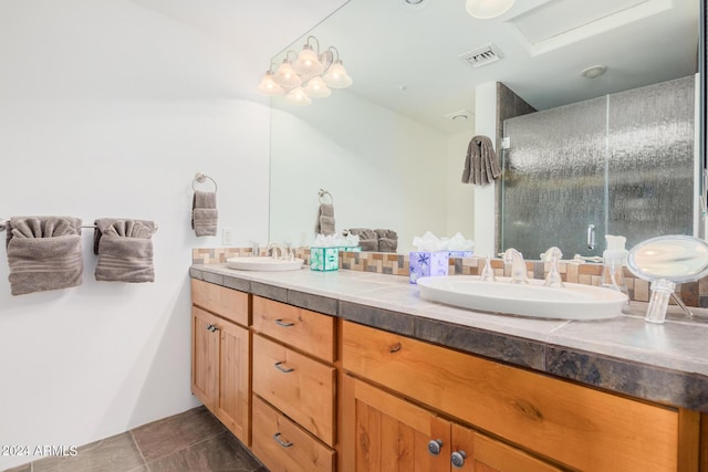 bathroom featuring tile patterned flooring and vanity