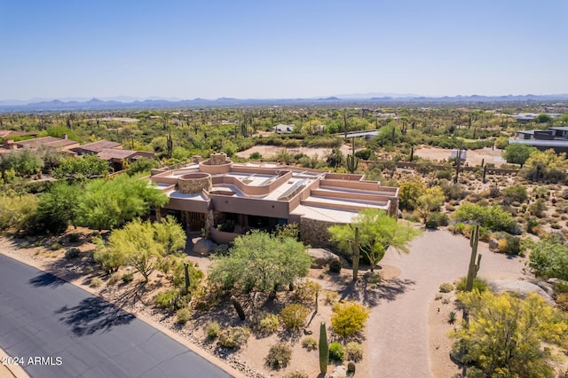 birds eye view of property with a mountain view