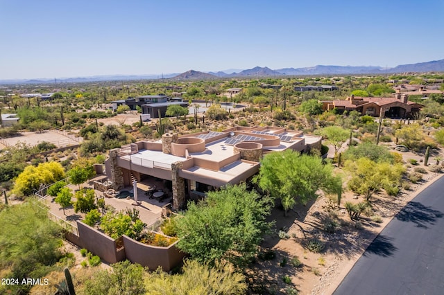 birds eye view of property with a mountain view