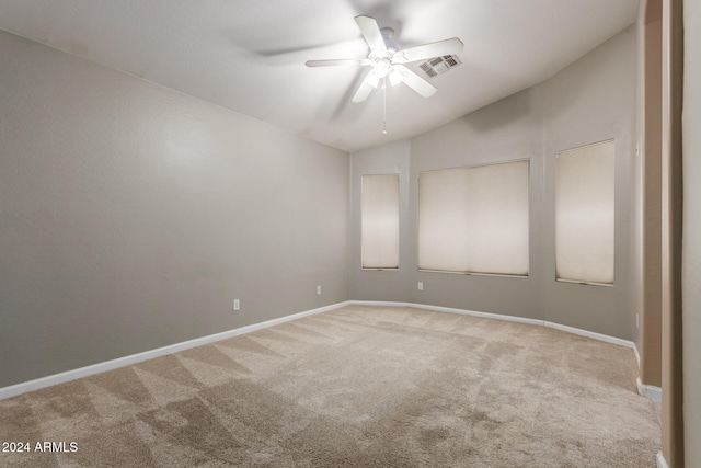 unfurnished room featuring carpet, ceiling fan, and lofted ceiling