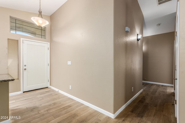 foyer with light wood-type flooring