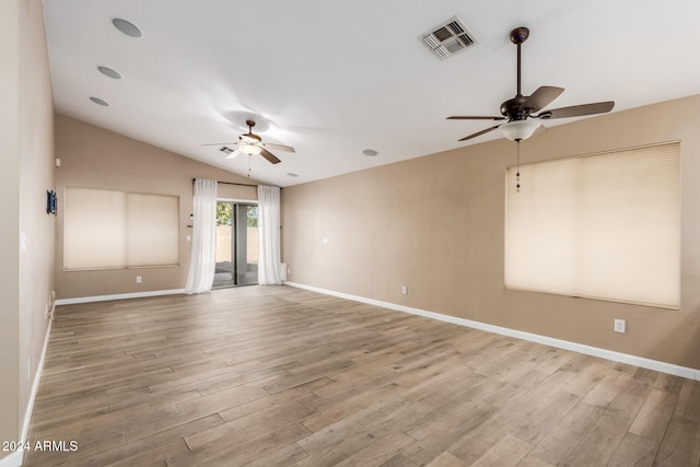 unfurnished room featuring hardwood / wood-style floors, ceiling fan, and lofted ceiling