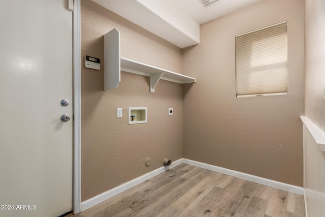 laundry area featuring electric dryer hookup, hookup for a gas dryer, light wood-type flooring, and hookup for a washing machine