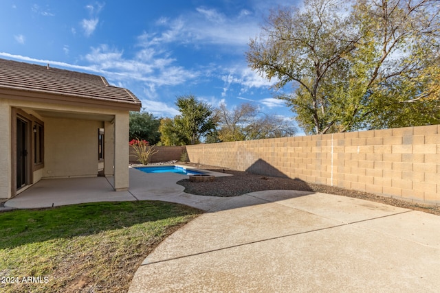 view of patio featuring a fenced in pool