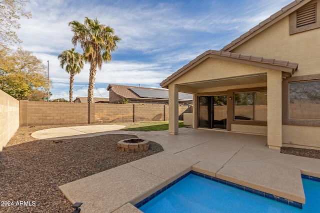 view of pool featuring an outdoor fire pit and a patio area