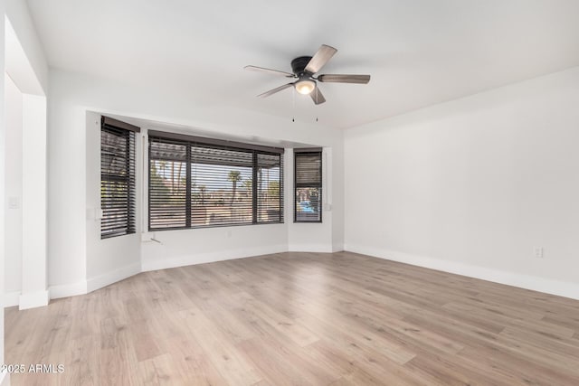 unfurnished room with ceiling fan and light hardwood / wood-style flooring