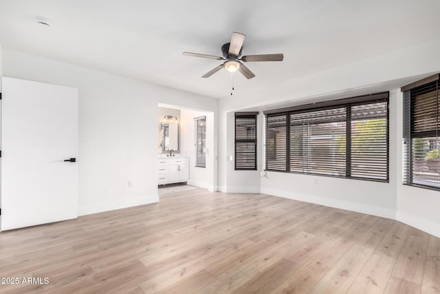 spare room featuring ceiling fan and light hardwood / wood-style floors