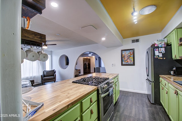 1340 E Townley Ave, Phoenix, AZ 85020 - kitchen with green cabinets, butcher block counters, appliances with stainless steel finishes, arched walkways, and open floor plan