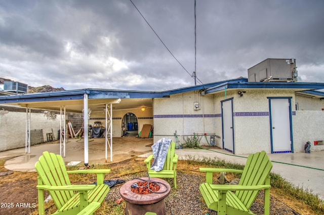 1340 E Townley Ave, Phoenix, AZ 85020 - back of property featuring a fire pit, stucco siding, and a patio area