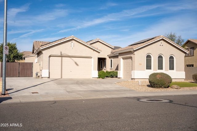 mediterranean / spanish-style home with a garage