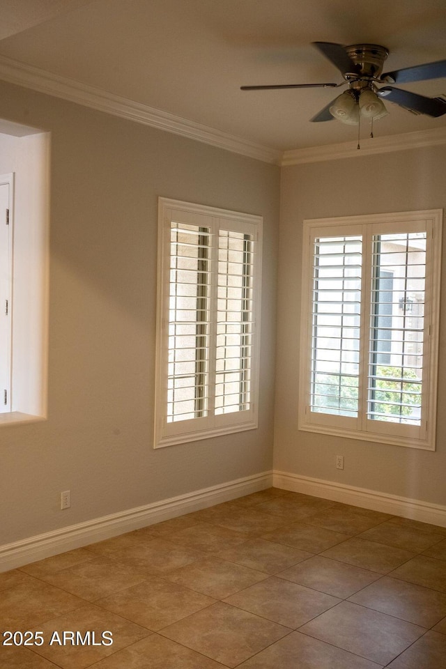 tiled empty room featuring ceiling fan and ornamental molding