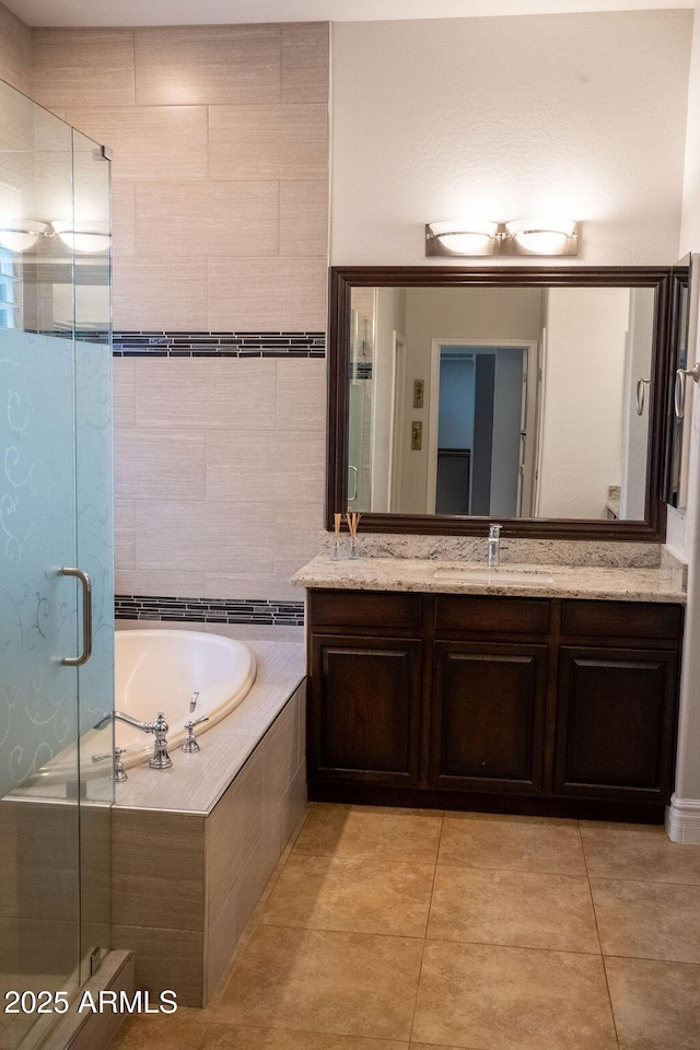 bathroom with vanity, shower with separate bathtub, and tile patterned flooring