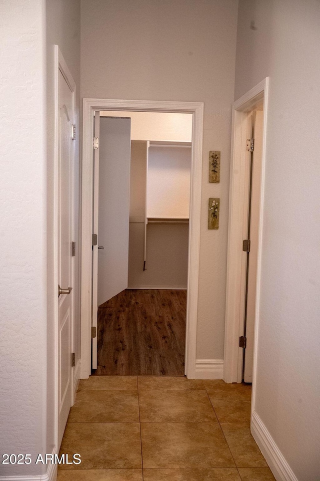 corridor with wood-type flooring