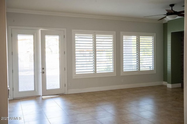 interior space featuring crown molding, light tile patterned flooring, ceiling fan, and french doors