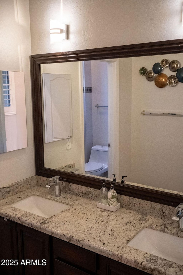 bathroom with vanity and toilet