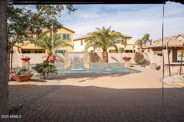 view of pool featuring a patio area and pool water feature