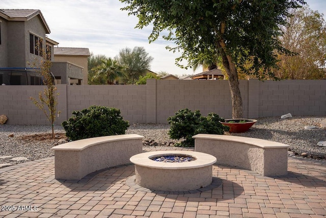 view of patio featuring an outdoor fire pit