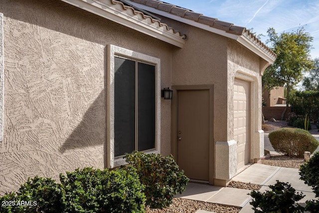 property entrance featuring a garage