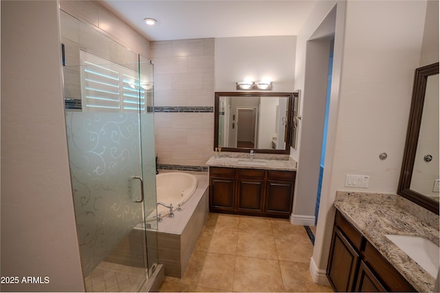 bathroom featuring vanity, tile patterned floors, and shower with separate bathtub